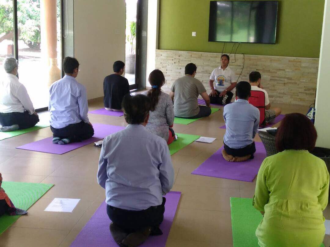Patient performing yoga at alpha healing center